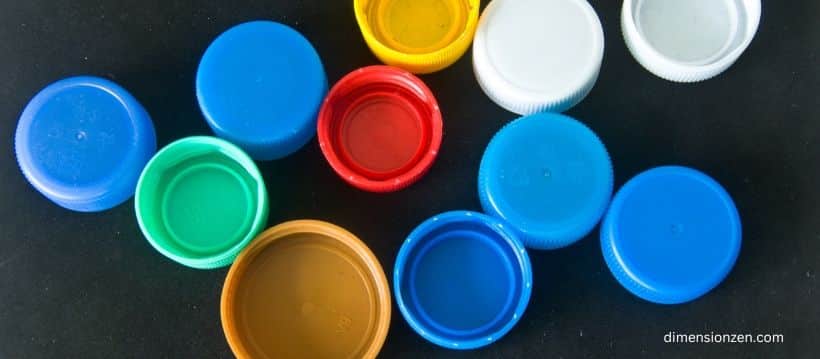 A Line of 15 Bottle Caps
